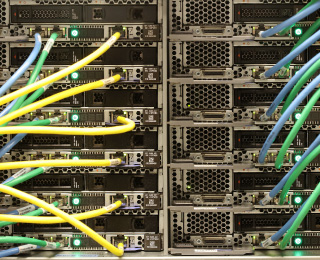 a snapshot of a server rack showing multiple wires connected to multiple devices